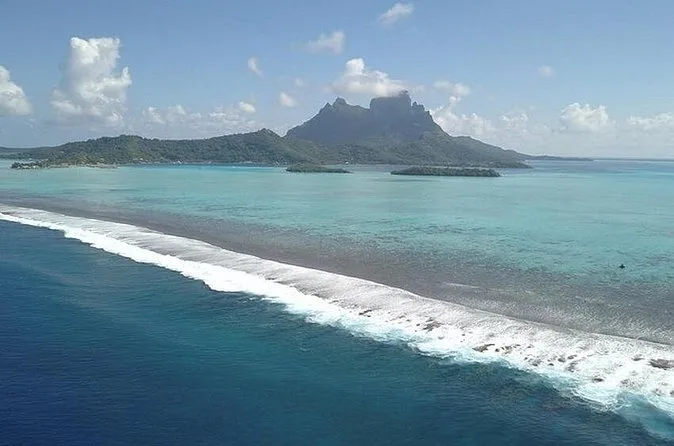 Aerial view of the Bora Bora lagoon inside the barrier reef, with Mount Otemanu